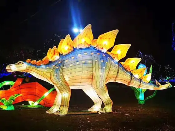 Estegosaurio luminoso LED con las placas dorsales iluminadas en color contrastado