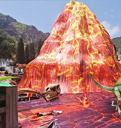 Volcán luminoso de gran formato con dinosaurios en la base
